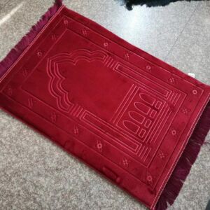 Thick padded red prayer mat 80x120 cm laid on the floor