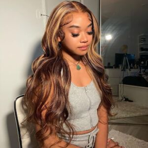 Body wave wig, brown with honey-blonde highlights, side view